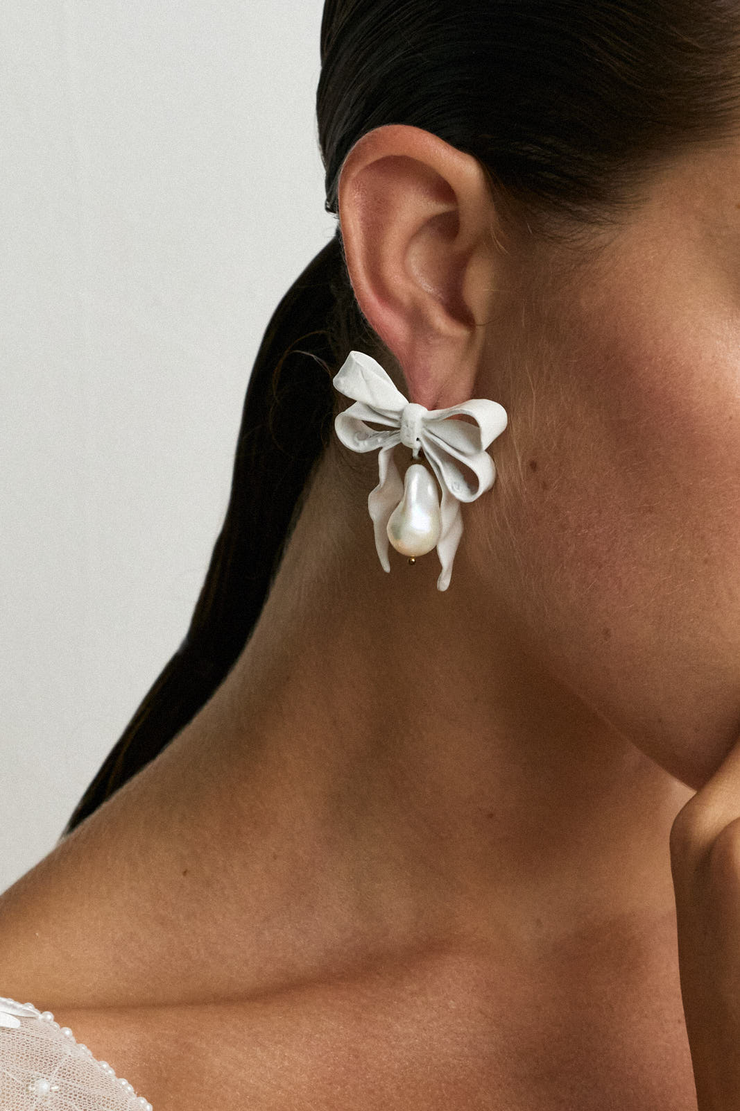 Luxury Designer Delina White Bow Pearl Earrings by Christie Nicolaides